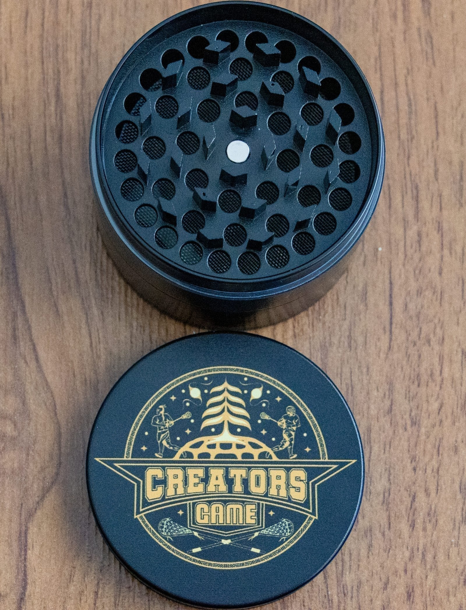 black and gold tobacco crusher 